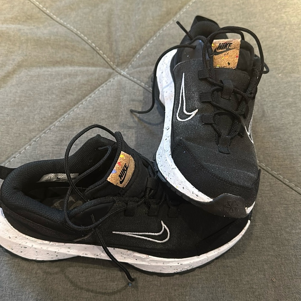 Black Canvas Ladies Nike Tennis Shoes. Made from recycled materials, size 7.5